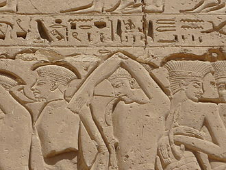 A people called the P-r-s-t (conventionally Peleset). From a graphic wall relief on the Second Pylon at Medinet Habu, c. 1150 BC, during the reign of Ramesses III. Bas relief de prisonniers philistins sur la facade sud du deuxieme pylone (2).JPG