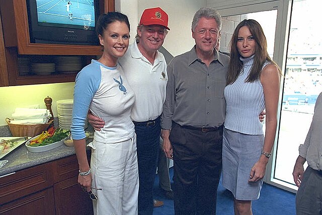 Sports Illustrated swimsuit model Kylie Bax wearing a Playboy shirt, with Donald Trump, Bill Clinton and Melania Trump (2000)