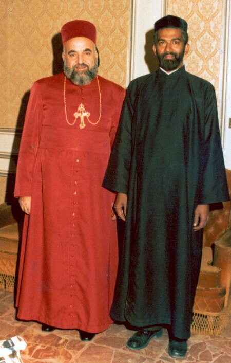 Ignatius Zakka I Iwas (left, dressed in red) in Damascus in 1981