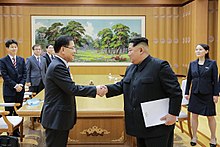 Chung Eui-yong of the South Korean delegation shakes hands with Kim Jong-un in Pyongyang. Chung Eui-yong and Kim Jong-un.jpg