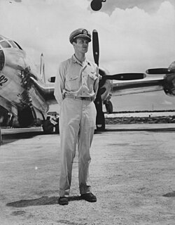 Photo of Ashworth in front of the Enola Gay.