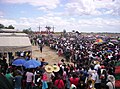 San Pedro Cutud Lenten Rites in City of San Fernando,Pampanga. There are three crosses with nailed men on the top of thehill with spectators, both local and foreigners, watching them.