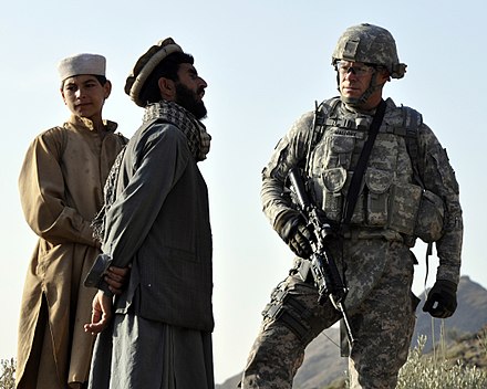 Kautiak villagers in Nuristan province with U.S. Navy commander (right)