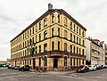 Tenement house in half-open development in a corner (structural unit with no. 100) and wash house in the courtyard