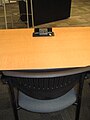 Connectivity at a sample desk. Includes power plug-in and ethernet jack.