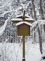 German sign in forest for walkers.