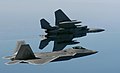 An F-15 Eagle banks left while an F/A-22 Raptor flies in formation en route to a training area off the coastline of Virginia on April 5.