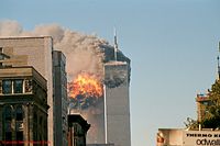 Fire and black smoke erupts from the Twin Towers.