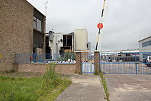 Plessey Semiconductors factory at Cheney Manor, Swindon, on 17 July 2012, undergoing demolition Former Plessey Microelectronics Factory Swindon.jpg