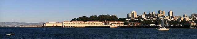 Fort Mason Center (foreground), with the Oakland hills visible to the left, and San Francisco's Russian Hill neighborhood visible to the right.