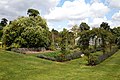 Garden lawn and path with rose trellis at Goodnestone Park Kent England.jpg