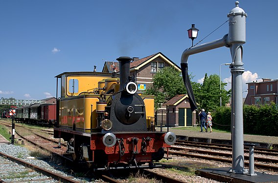 Steam locomotive "Magda" replenishing water at Haaksbergen