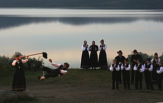 Hallgrim Hansegard (Frikar) demonstrating the Halling during the annual Peer Gynt Festival at Lake Gala. Hallingkast.jpg