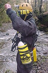 British cave diving style sidemounting harness, side view, with cylinders, weights and battery pack