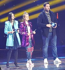 Helena Meraai, Zinaida Kuprijanovitsj og Jevgenij Parlin, programleiarar for Junior Eurovision Song Contest i 2018.