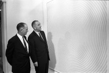 U.S. President Lyndon Baines Johnson and U.S. Senator J. William Fulbright inspect "Squaring the Circle", a bright red 1963 painting by Richard Anuszkiewicz, at the 1965 White House Arts Festival.