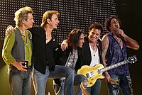 Three of the six tracks on the EP are covers of songs by Journey (current lineup pictured).