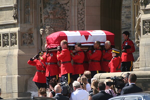 Jack Layton's casket being moved from the Centre Block of the parliament buildings after lying in state