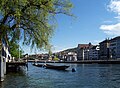 Standing on a private boat deck in Zürich, I take a picture of the Limmat.