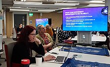 A computer screen reading "What can university departments do to help?" at the University of Edinburgh in Scotland Lorna Campbell at Ada Lovelace Day 2018 - what can university departments do to help.jpg