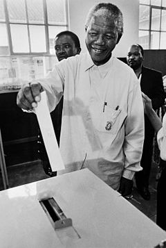 Nelson Mandela voting in 1994, after thirty years of imprisonment.