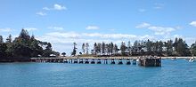 The wharf on the southern side of the island, with the bay behind filled with day-tripper boats