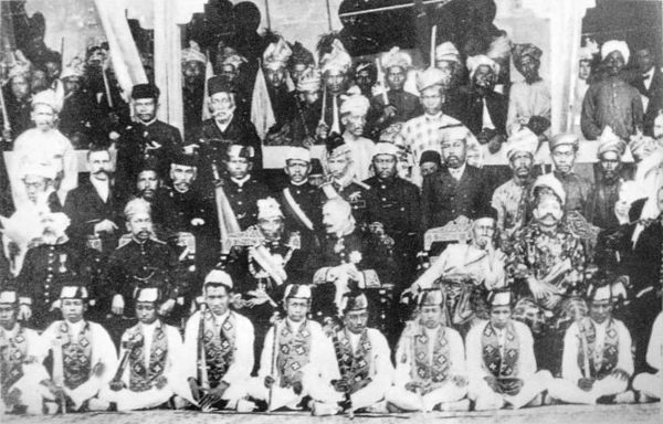 A commemorative group photograph taken at the 2nd Durbar held on 20 July 1903. sitting from left to right: William Treacher (resident-general), Sultan