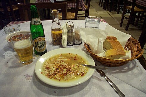 A bowl of Greek patsás (with skordostoubi and hot pepper flakes)
