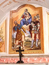 Gorrino.  Sataa.  San Roccon maalaiskappeli.  Neitsyt ja pyhät Rocco (vas.) ja Bovo.  Taustalla Gorrinon kylä.  17./18. vuosisadalla.