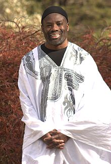 Philip Emeagwali wearing the Boubou (or Agbada), a traditional robe symbolic of West Africa Philip Emeagwali in white "agbada.".jpg