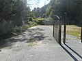 The entrance to the cemetery used to be part of NY 106 itself.