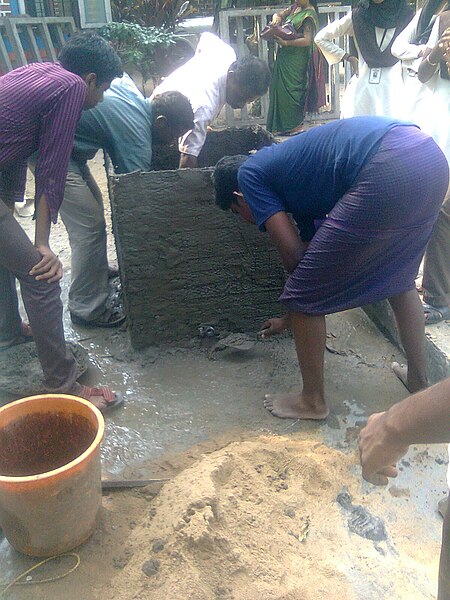 File:Plastering of Ferrocement Tank.jpg