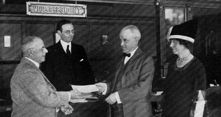 Millikan receives a check for over $40,000 for winning the Nobel Prize