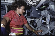 Lucid conducts Development Test Objective (DTO) 1208, Space Station Cursor Control Device Evaluation II and Advanced Applications, at the payload station on the aft flight deck of the Space Shuttle Atlantis