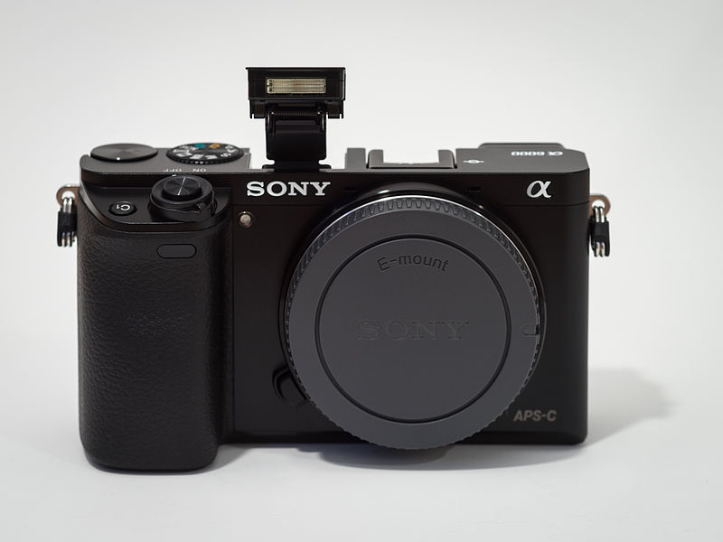 File:Sony Alpha ILCE-6000 APS-C-frame camera with body cap flash extended.jpeg