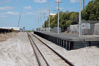 Dual gauge track at South Beach station in February 2006 South beach south.jpg