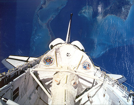 Shuttle Columbia during STS-50 with Spacelab Module LM1 and tunnel in its cargo bay.