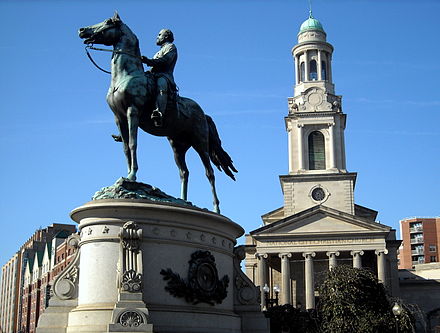 The Thomas statue with the National City Christian Church in the background.