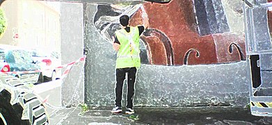 Street artist (le muraliste Piet Rodriguez) en action, rue D'Alembert à Grenoble, lors de l'édition 2018.