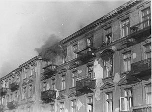 NARA copy #39 Bandits jump to escape capture Men preparing to commit suicide by jumping off the upper floors of 23 and 25 Niska Street. 22 April 1943