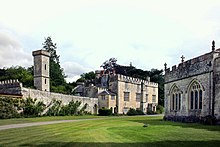 Teffont Manor (left, with water tower) is close to the church (right) Teffont Manor (geograph 3306383).jpg