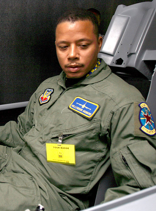 Howard preparing for the role by riding an F-16 flight simulator