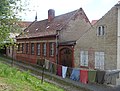 Residential house in closed development and two back buildings