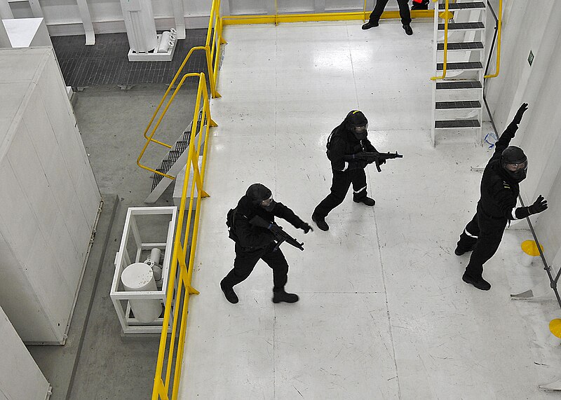 File:US Navy 100708-N-7643B-099 Two Republic of Singapore Navy sailors advance on a suspect during a simulated boarding exercise in the boarding and search trainer.jpg