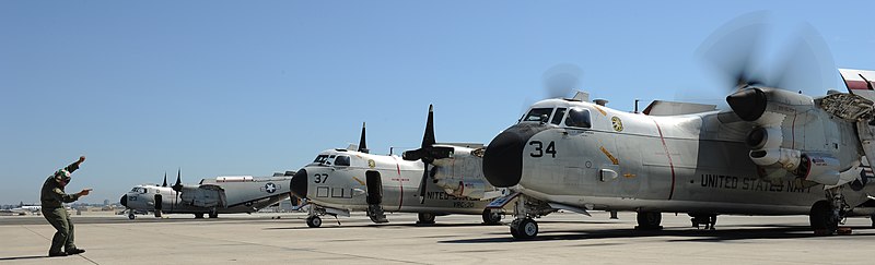 File:US Navy 100817-N-9576C-193 Naval Air Crewman 2nd Class Rodrigo Carino signals to the pilots of a C-2A Greyhound as they start their port side engine for a flight training operation.jpg