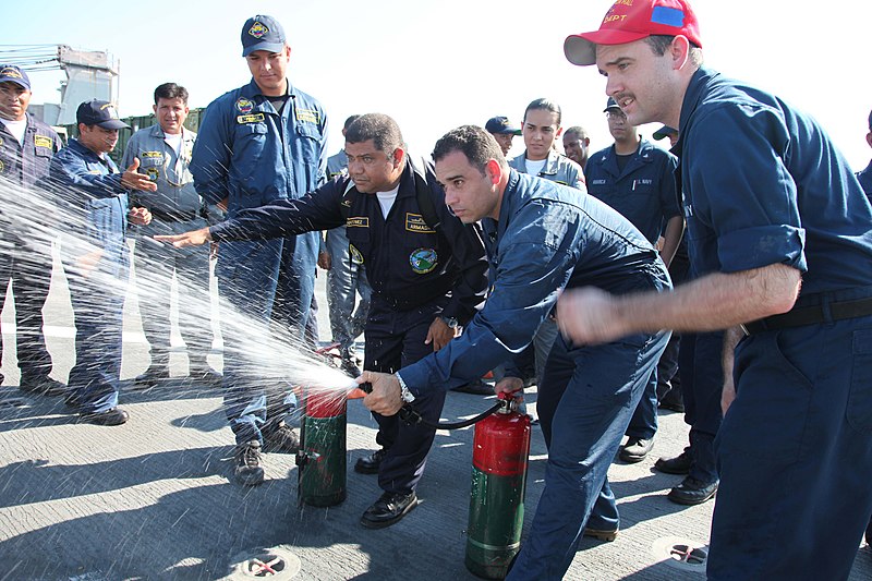 File:US Navy 110203-A-0566T-331 Damage Controlman Daniel O'Connor acts as a safety as members of the Colombian coast guard demonstrate.jpg