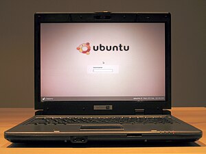 A System76 laptop displays the Ubuntu Edgy log...