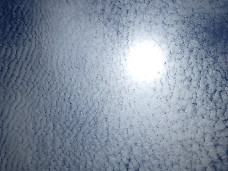 File:"The sun with clouds.jpg