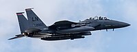 An F-15E Strike Eagle, tail number 01-2003, taking off from RAF Lakenheath in England. The aircraft is assigned to the 494th Fighter Squadron.