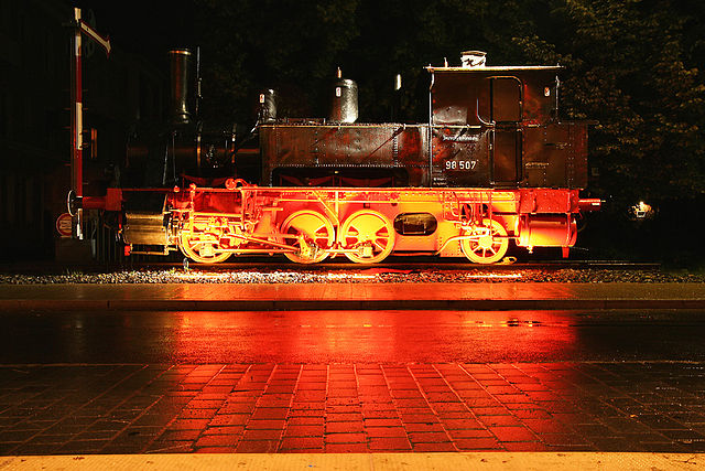 Plinthed locomotive 98 507 in front of the station